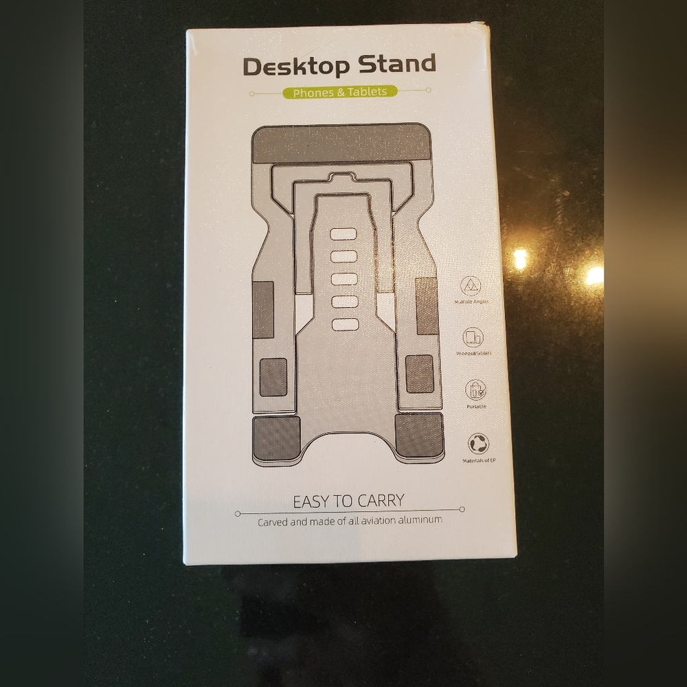 Portable Desktop Stand for Phones and Tablets.